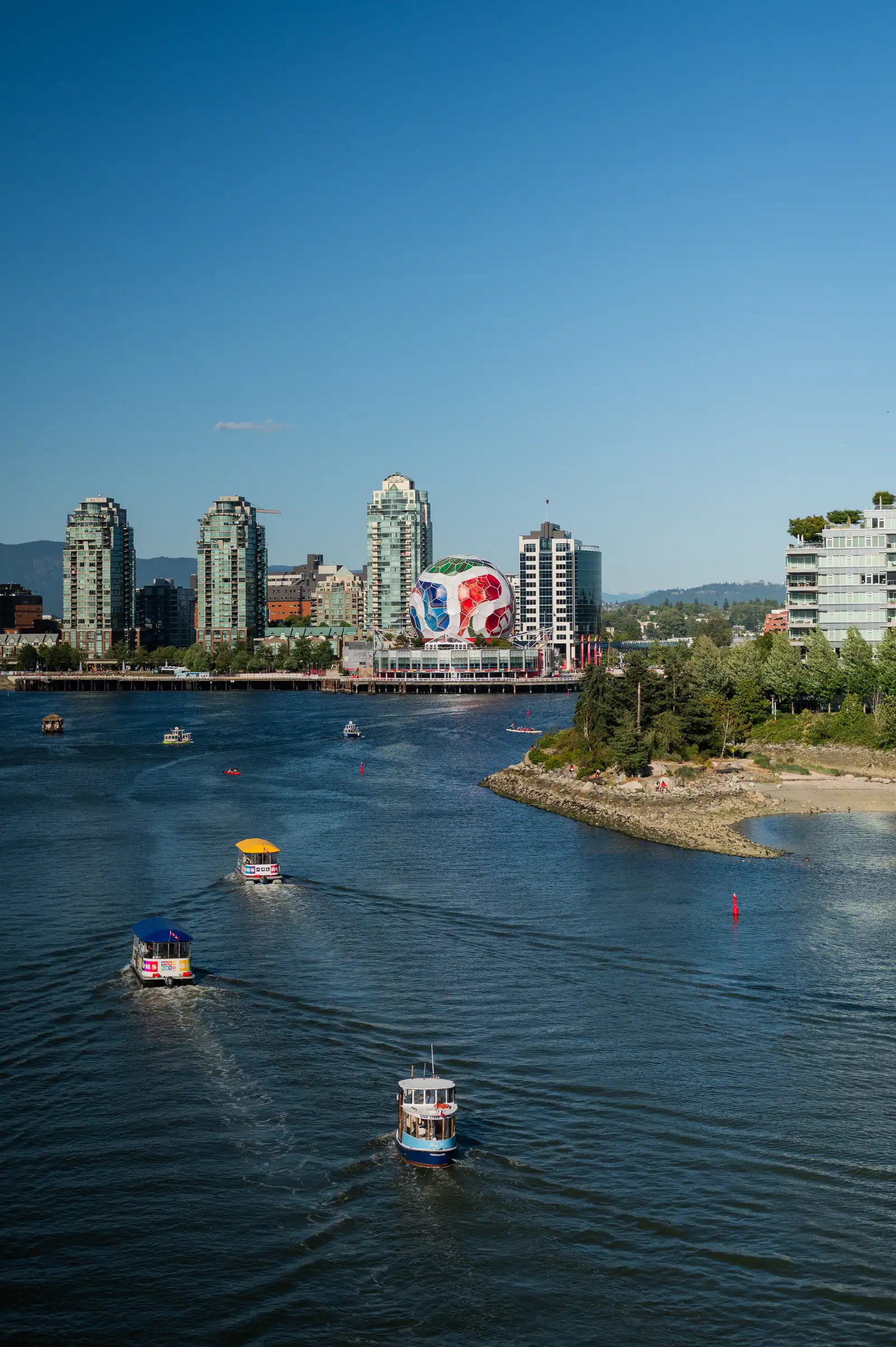 Vancouver cityscape with a large colorful World Cup football structure by the waterfront